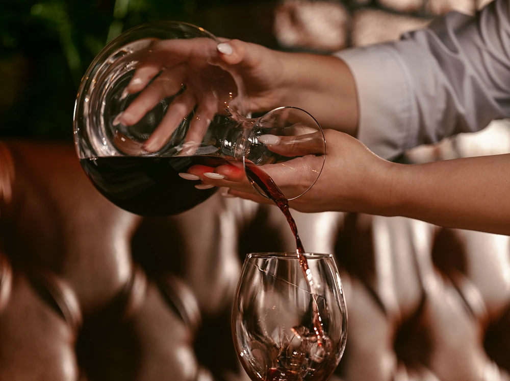 Red wine being poured at G SNAIL